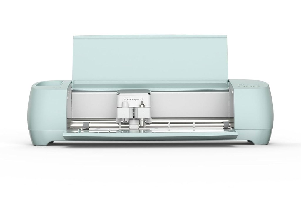 A white covered Cricut Explore 3 Machine