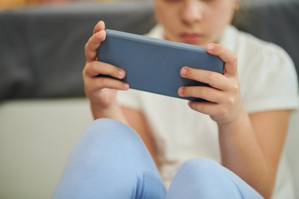 Boy using cell phone