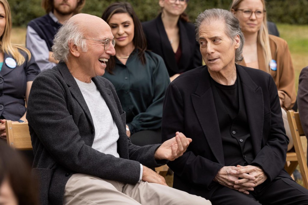 Larry David laughing with Richard Lewis. 