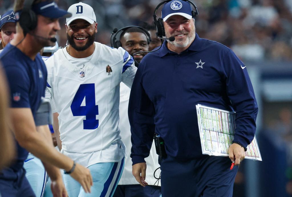 Cowboys quarterback Dak Prescott (4) with head coach Mike McCarthy.