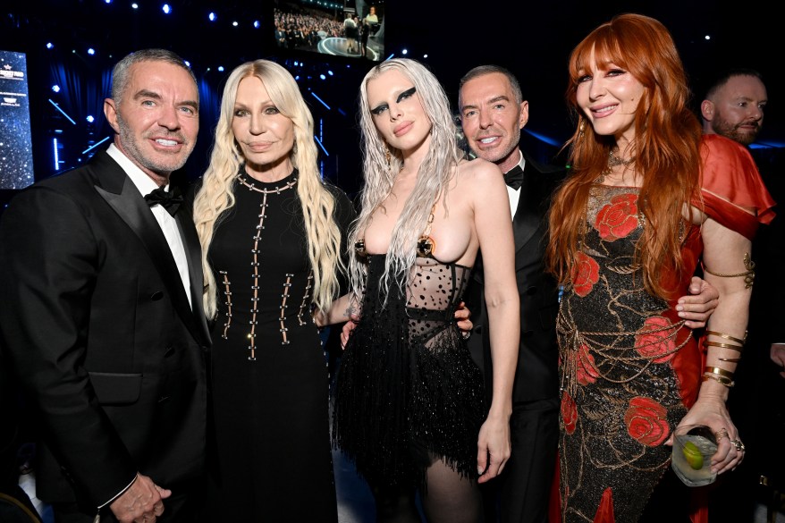 Dan Caten, Donatella Versace, Julia Fox, Dean Caten, and Charlotte Tilbury posing for a photo at Elton John AIDS Foundation's Annual Academy Awards Viewing Party.