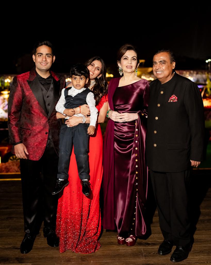 Mukesh Ambani and his wife Nita are seen with their older son Akash Ambani, his wife Shloka Mehta and their young son. 