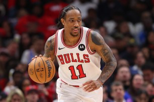 DeMar DeRozan #11 of the Chicago Bulls dribbles up the court against the Dallas Mavericks during the second half at the United Center.