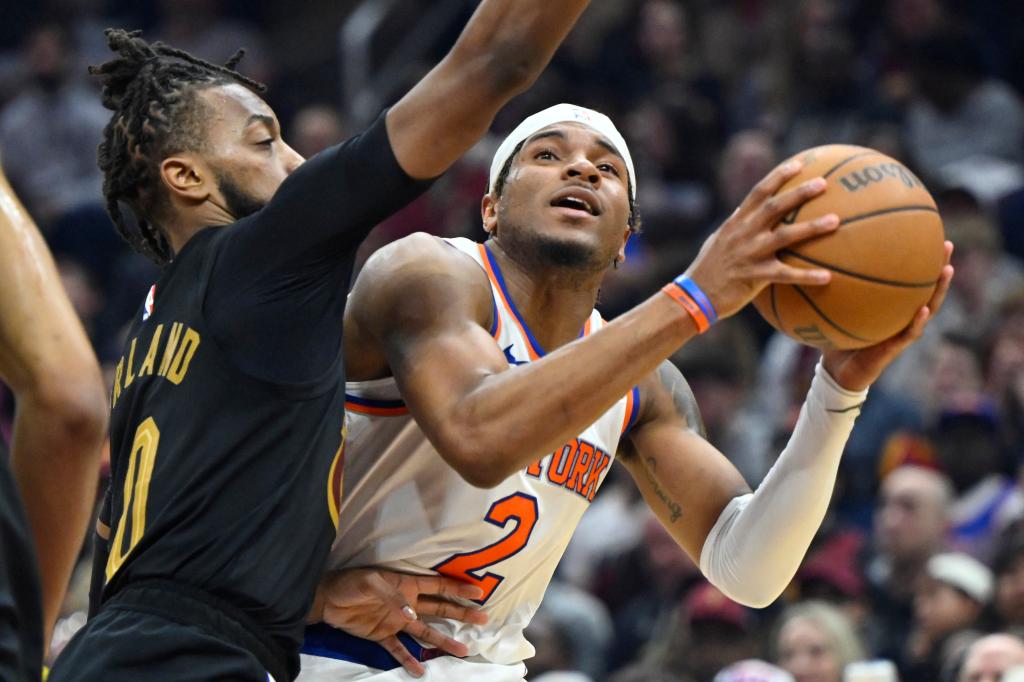 Cleveland Cavaliers guard Darius Garland (10) defends New York Knicks guard Miles McBride (2) in the second quarter.