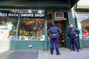 Zaza Waza, padlocked yesterday with NYPD officers patrolling the scene.