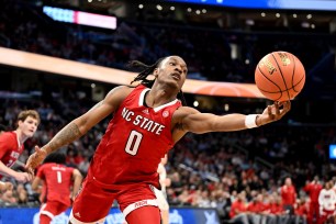 DJ Horne #0 of the North Carolina State Wolfpack grabs a rebound in the second half against the Virginia Cavaliers.