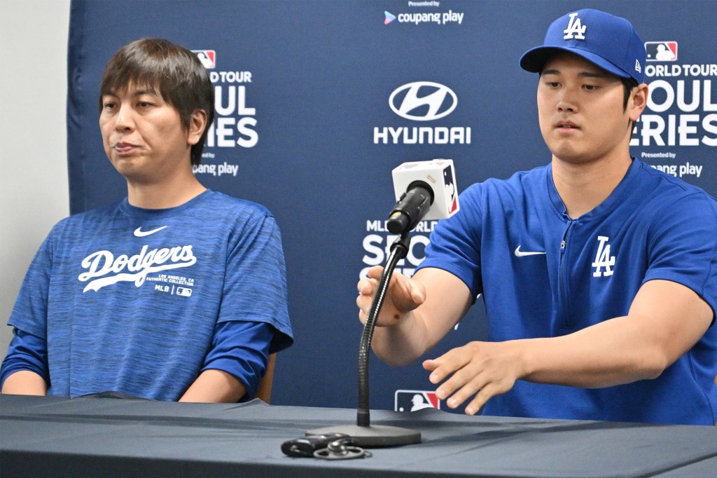 Interpreter Ippei Mizuhara (L) and Shohei Ohtani are seen at a Dodgers press gathering on March 16, 2024.