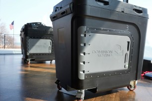 Dominion Voting tabulator machines shown in use for the Michigan primary election in Grosse Pointe Farms, Mich.