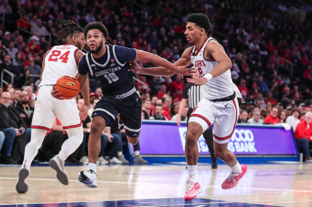 Jayden Epps drives past St. John's Red Storm guard RJ Luis Jr. (12) in the first half at Madison Square Garden.