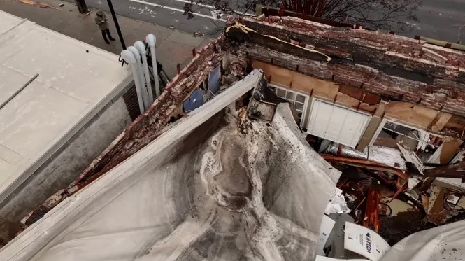 Mary Mac's Tea Room suffered a partial roof collapse and other significant damage after over 3 inches of rain fell across the city overnight. 