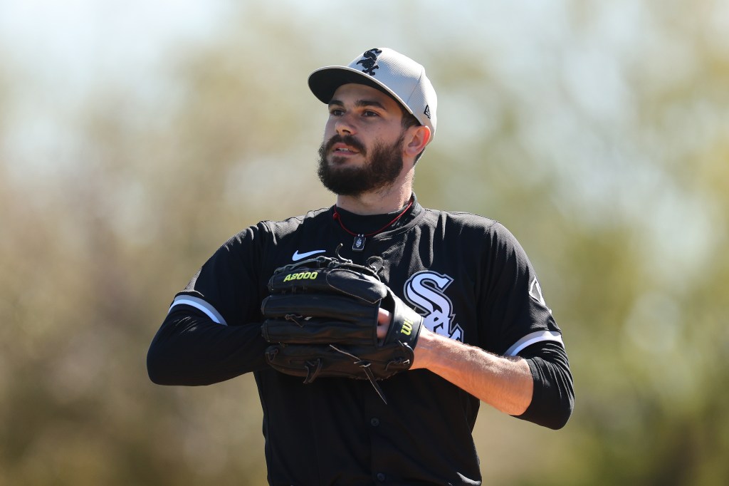 Dylan Cease #84 of the Chicago White Sox looks on during a spring training workout