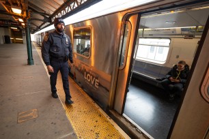 A NYPD officer patrolling a subway platform in the Bronx on March 27, 2024.