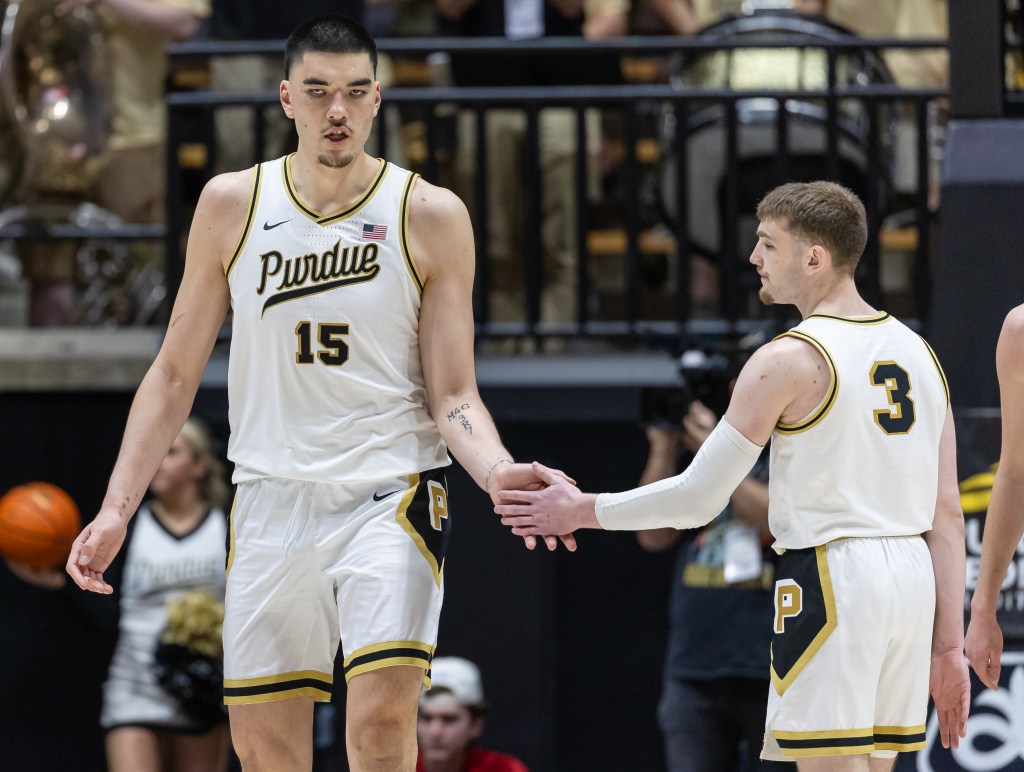 Zach Edey #15 and Braden Smith #3 of the Purdue Boilermakers high five during the game against the Wisconsin Badgers.