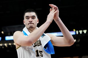 Zach Edey #15 of the Purdue Boilermakers celebrates after beating the Utah State Aggies 106-67 in the second round of the NCAA Men's Basketball Tournament.