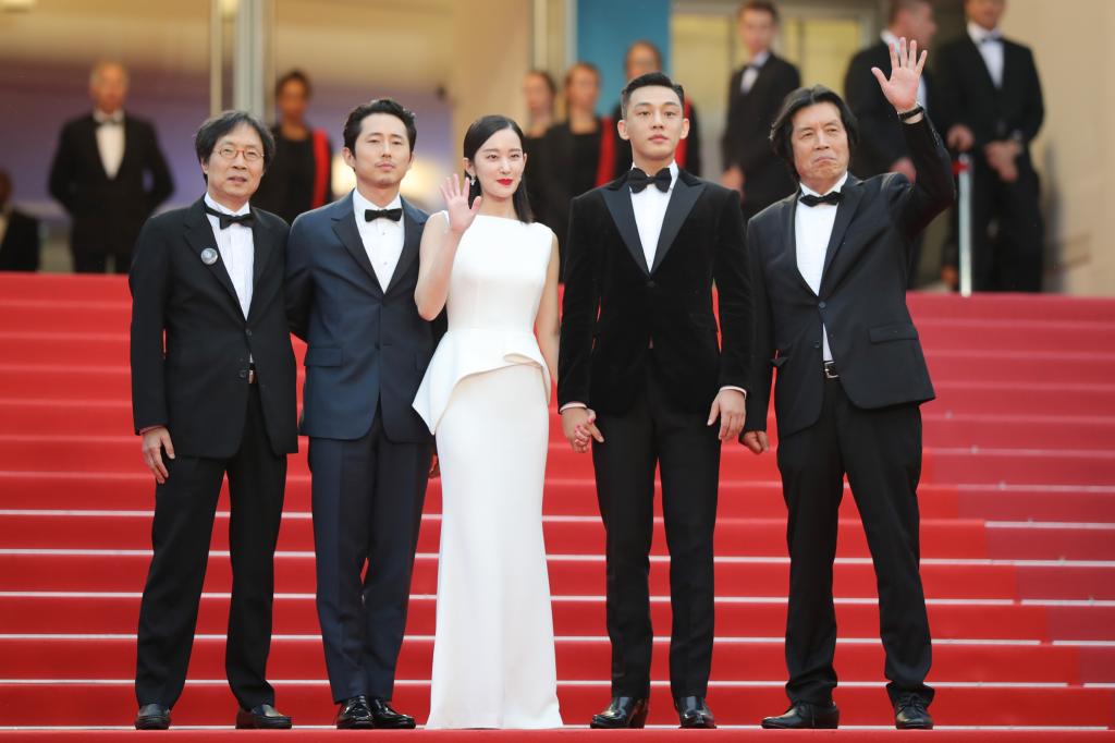 Executive producer Jun-dong Lee, actor Steven Yeun, actress Jong-seo Jeon, actor Ah-in Yoo and director Chang-dong Lee attend the screening of "Burning" during the 71st annual Cannes Film Festival at Palais des Festivals on May 16, 2018 in Cannes, France.