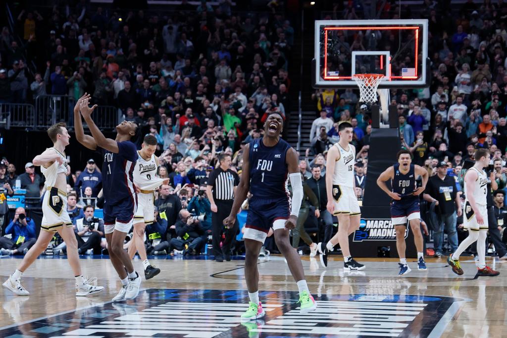 Players from the Fairleigh Dickinson Knights celebrate their win over the Purdue Boilermakers in the first round of the 2023 NCAA Men's Basketball Tournament held at Nationwide Arena on March 17, 2023 in Columbus, Ohio. 