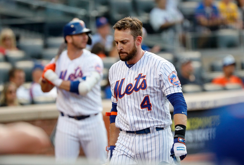 ed Lowrie #4 of the New York Mets reacts after he strikes out swinging in the 9th inning
