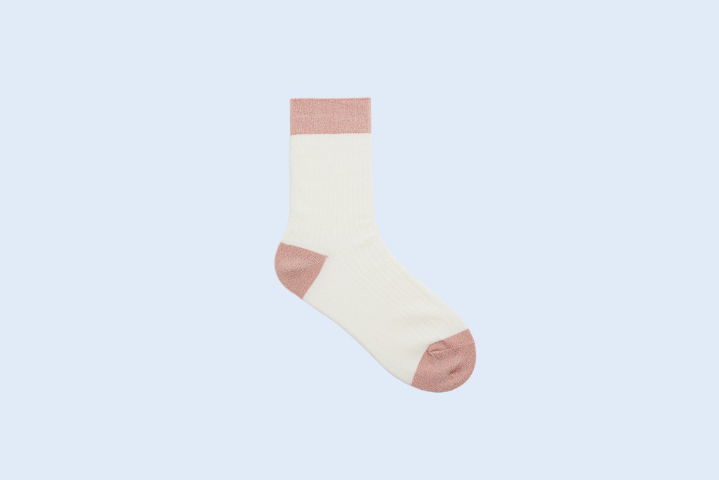 Image of a single, sparkly white sock with pink accents