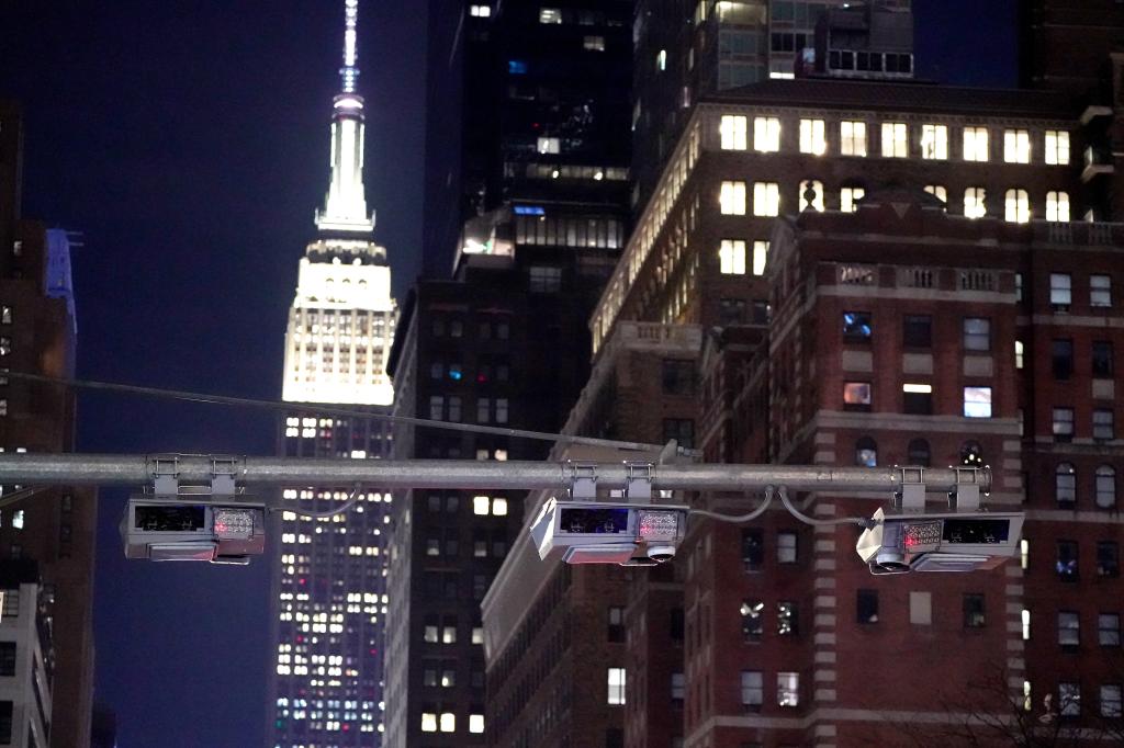 A general view of a congestion pricing toll gantry with the Empire State Building 