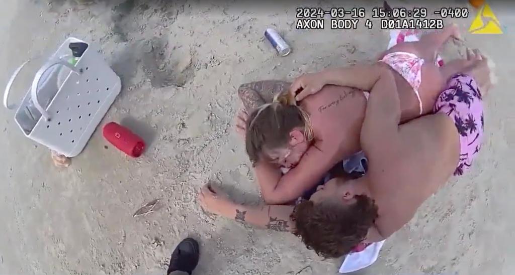 Alyssia Langley and Timothy Stephens are seen in body camera footage sleeping on the beach.