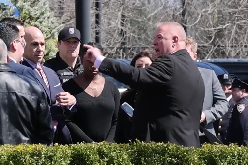 A man seen confronting Kathy Hochul on her way out of the wake.