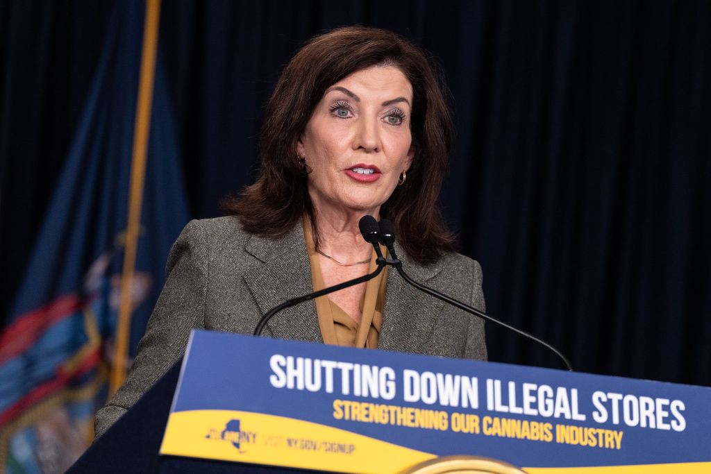 Kathy Hochul speaking into a microphone at a podium