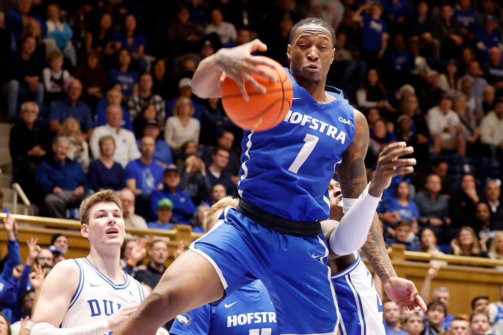 Duke's Mark Mitchell, behind, during the second half of an NCAA college basketball game in Durham, N.C.