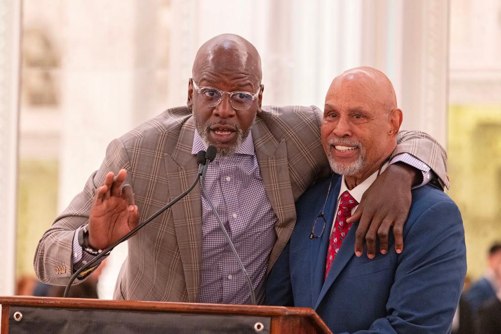 Tyrone Grant hugging Mike Jarvis the head coach of the 1998-1999 St. John's men's basketball team, speaking at a celebration dinner for the 1998-1999 team at the Pierre hotel on Friday February 2, 2024.