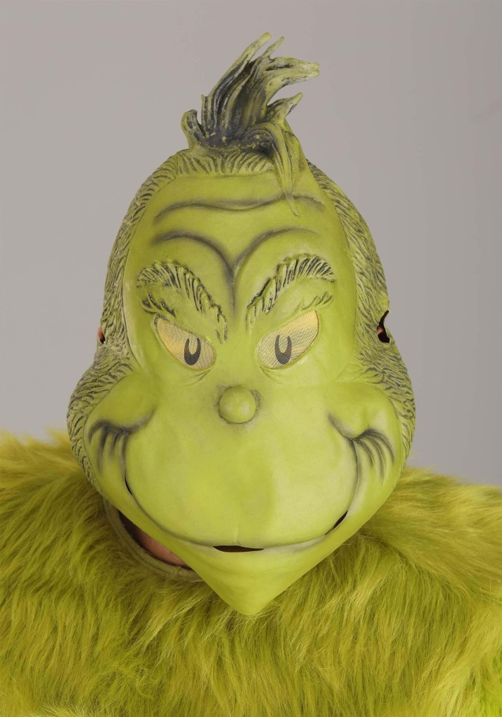 A scary Grinch mask with green fur and an angry expression.