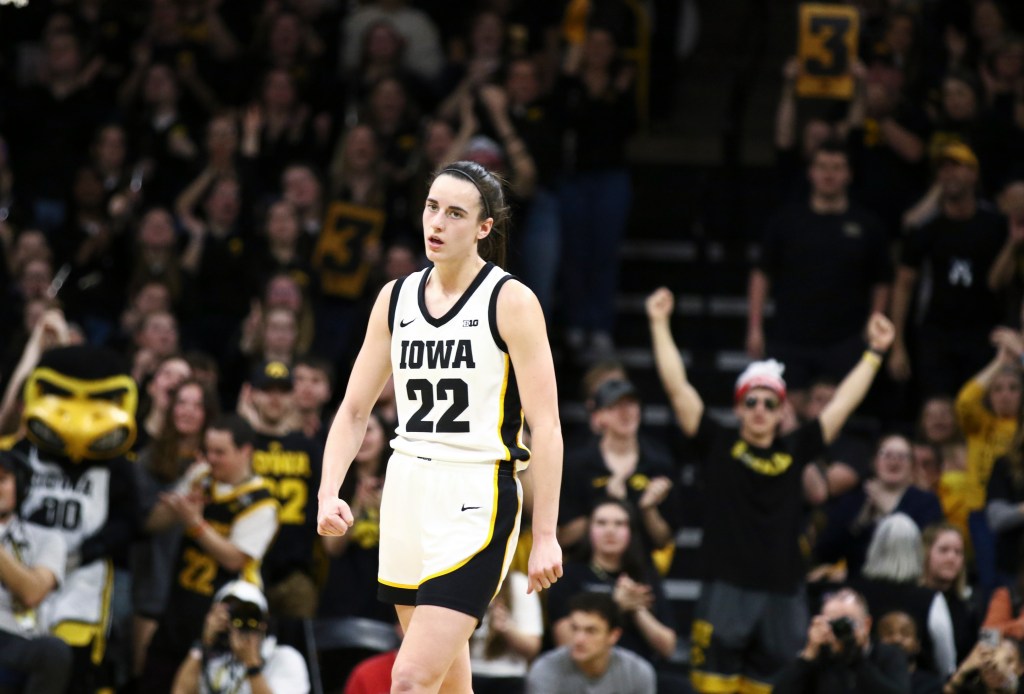 Guard Caitlin Clark #22 of the Iowa Hawkeyes is applauded during the second half after a basket against the Ohio State Buckeyes at Carver-Hawkeye Arena on March 3, 2024 in Iowa City, Iowa.  