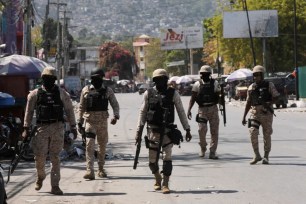 Police patrol a street after authorities extended the state of emergency amid gang violence in Port-au-Prince, Haiti.