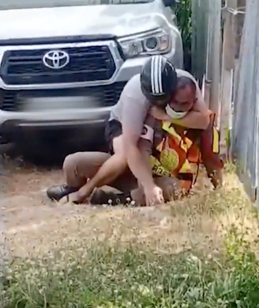 Two men hugging each other