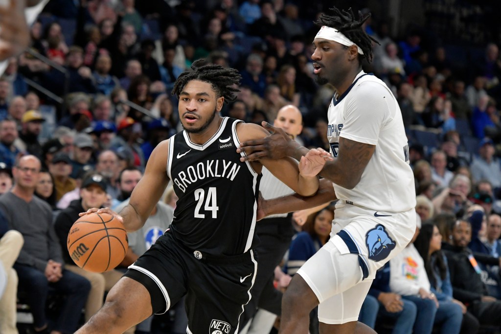 Brooklyn Nets guard Cam Thomas (24) handles the ball against Memphis Grizzlies guard Vince Williams Jr.