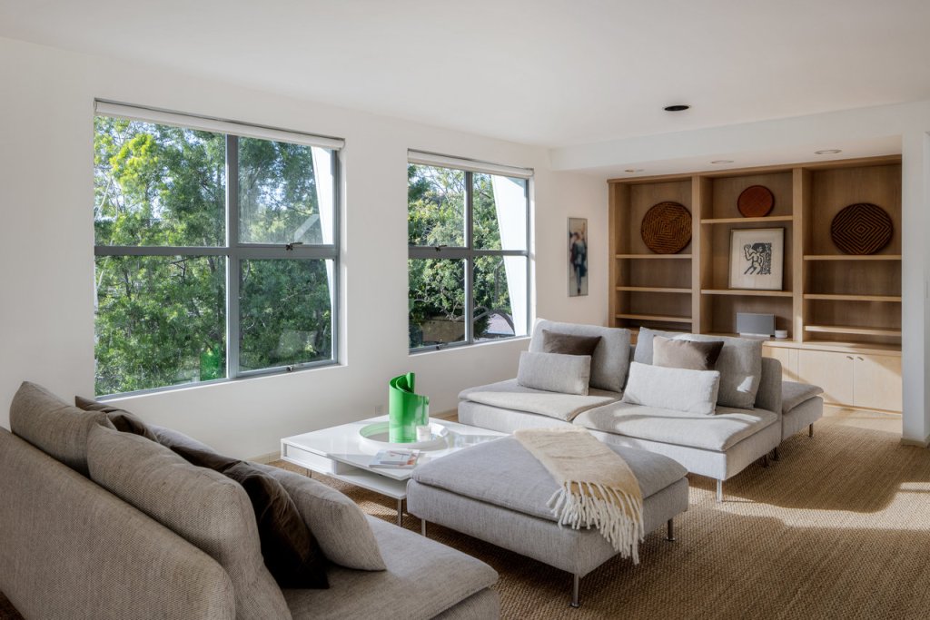 A sitting area next to large windows.