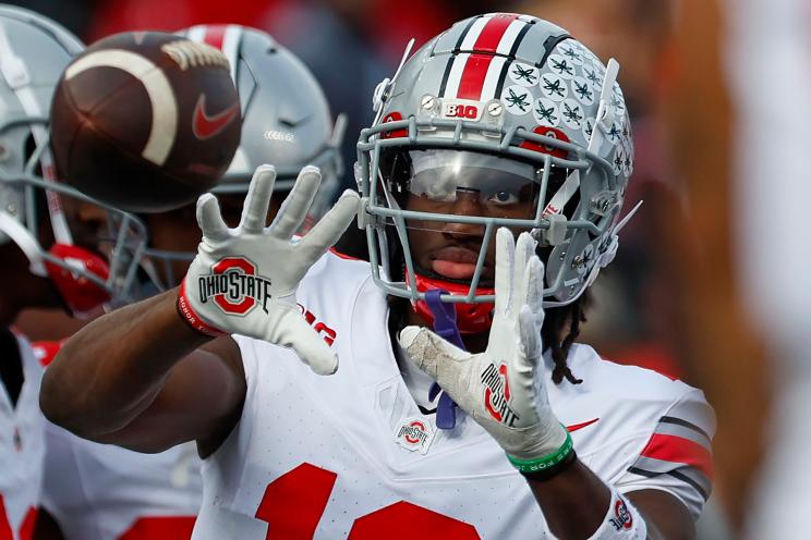 Wide receiver Marvin Harrison Jr. #18 of the Ohio State Buckeyes warms up on the sidelines during a college football game against the Rutgers Scarlet Knights at SHI Stadium on November 4, 2023 in Piscataway, New Jersey.