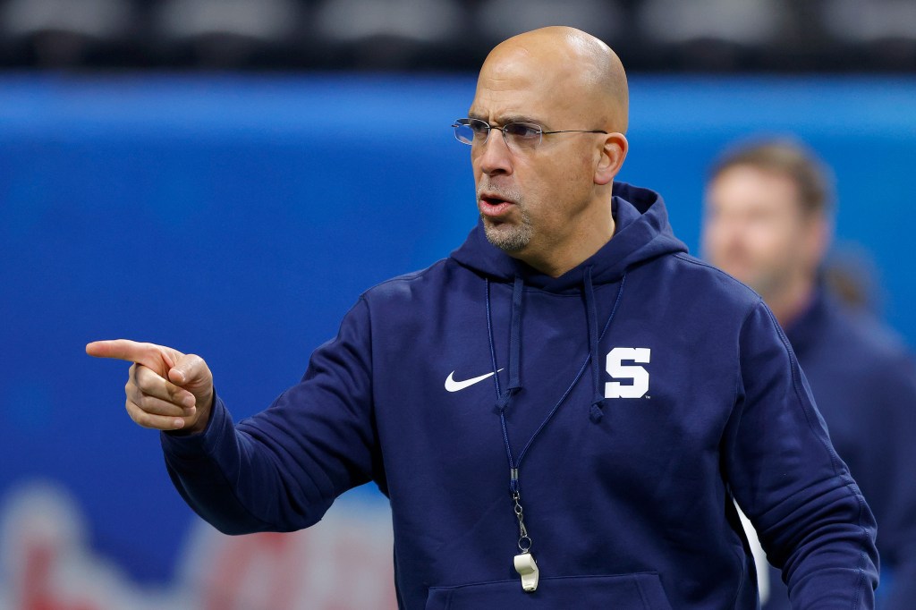 Head coach James Franklin of the Penn State Nittany Lions leads his team through warmups