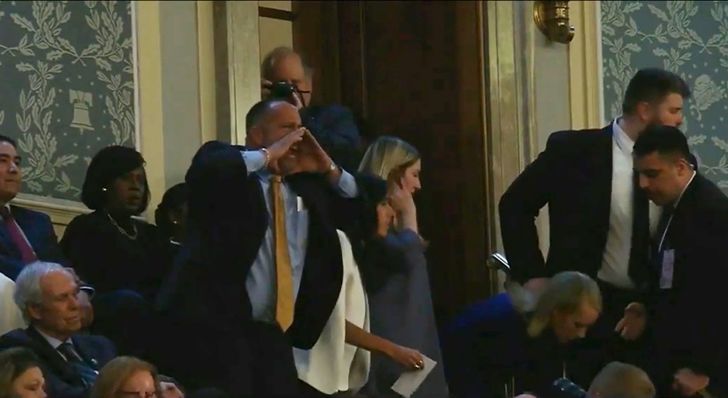 The heckler who shouted at President Biden during his State of the Union address Thursday night was identified as the father of a fallen Marine and was later arrested over the disruption.