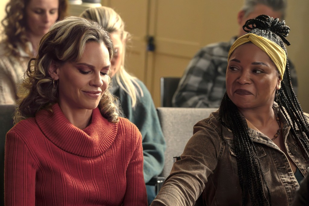 Actors Hilary Swank and Tamala Jones sit side-by-side in a still from the film "Ordinary Angels."