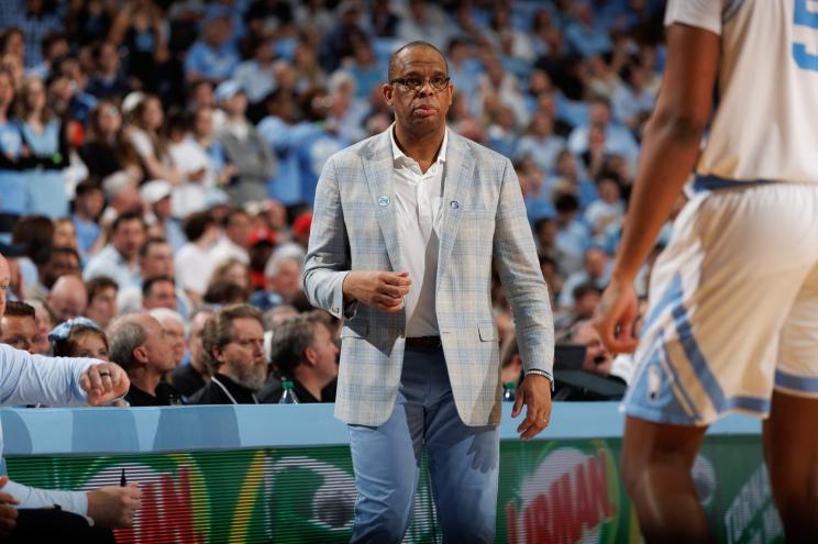 Head coach Hubert Davis of the North Carolina Tar Heels coaches during a game against the North Carolina State Wolfpack.