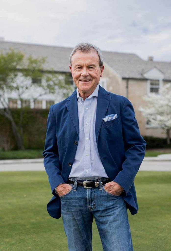 Hughes Norton, Tiger Woods' first agent, wearing a blue jacket