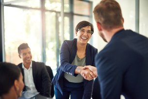 Group of businesspeople meeting in a boardroom.