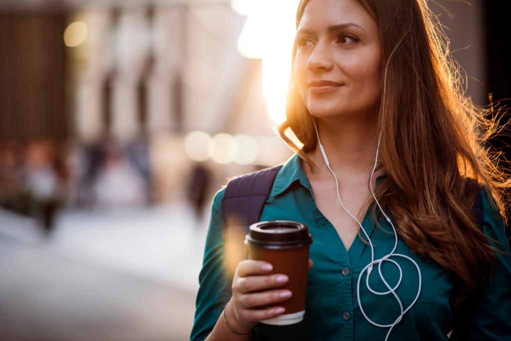 Woman walking with coffee