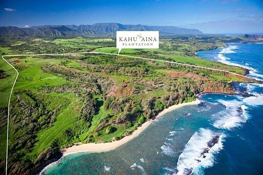 Aerial view of Kahuâaina, Mark Zuckerberg's real estate purchase, including a beach and land.