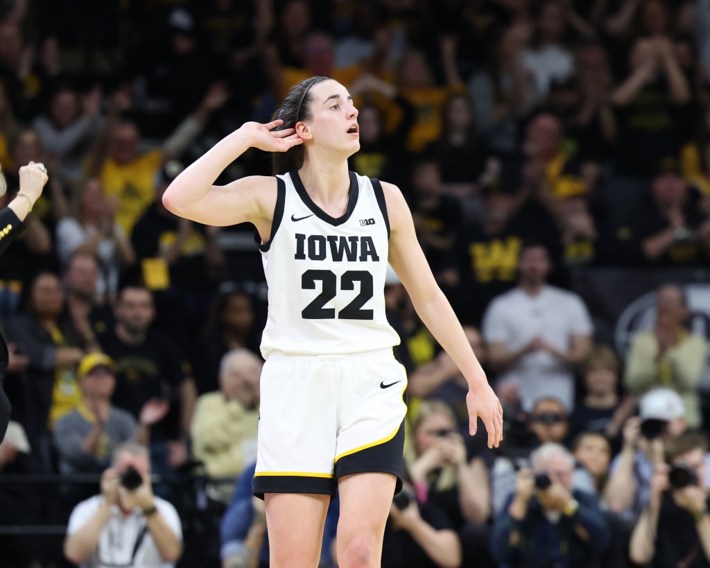 Caitlin Clark (22) celebrates the win over the Ohio State Buckeyes during the second half at Carver-Hawkeye Arena. 