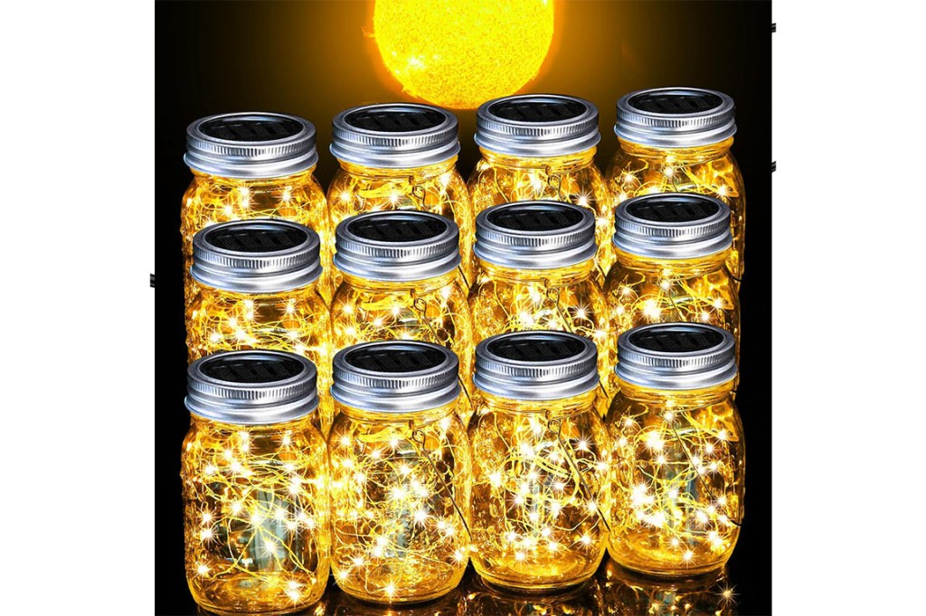 A group of glass jars with lights.