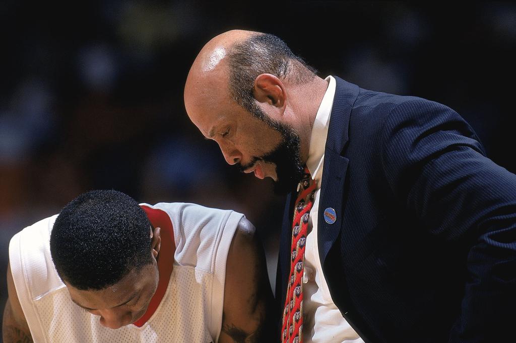 Head coach Mike Jarvis of the St Johns (NY) Red Storm talks to his player during a NCAA game against Samford Bulldogs at the Orlando Arena in Orlando, Florida. The Red Storm defeated the Bulldogs 69-43. 