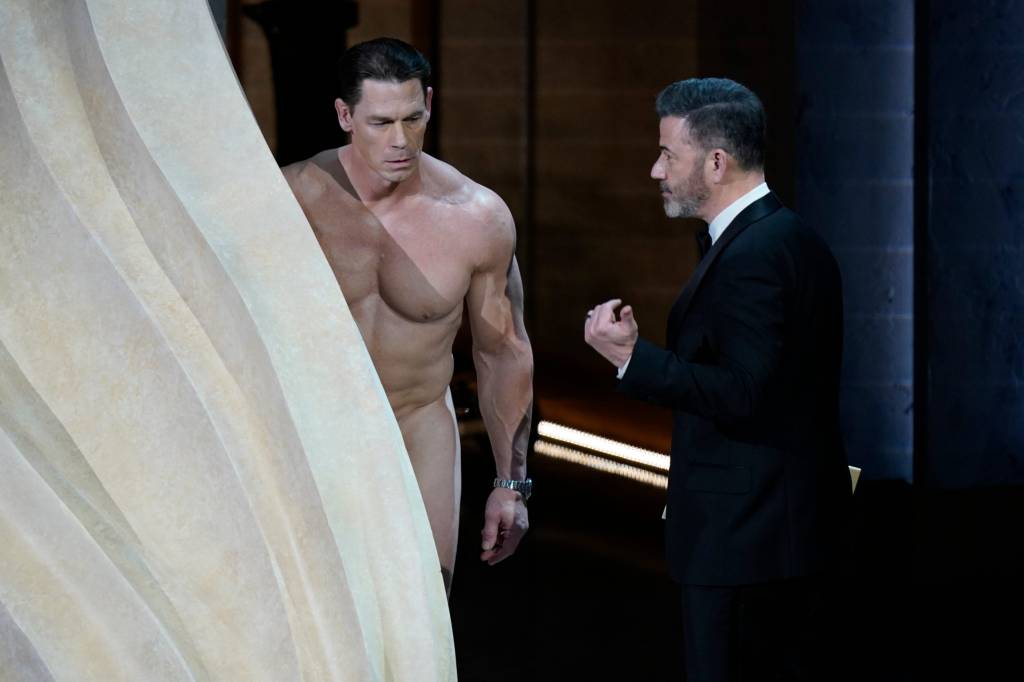 Jimmy Kimmel "coaxing" John Cena to come out and present the Best Costume Oscar on Sunday's awards show on ABC.