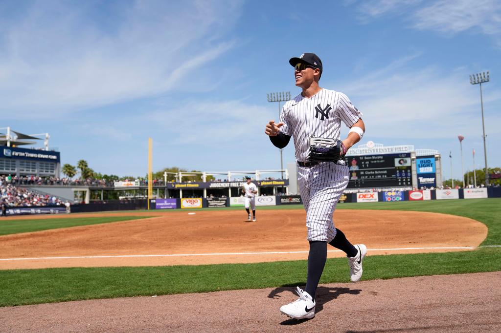 New York Yankees center fielder Aaron Judge runs to the dugout in the third inning of a spring training baseball game against the Atlanta Braves Sunday, March 10, 2024, in Tampa, Fla.