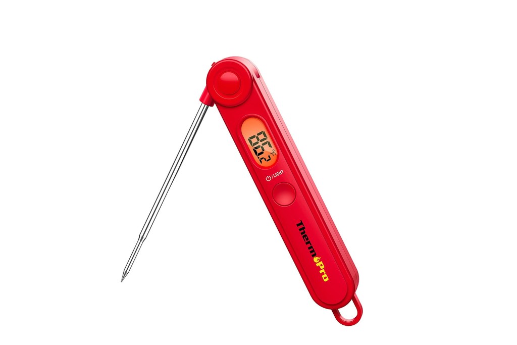 A red thermometer with a long handle