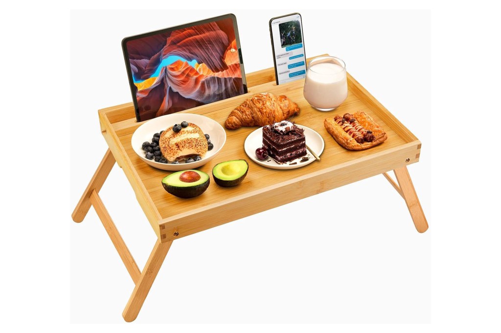 Laptop and food on a table.